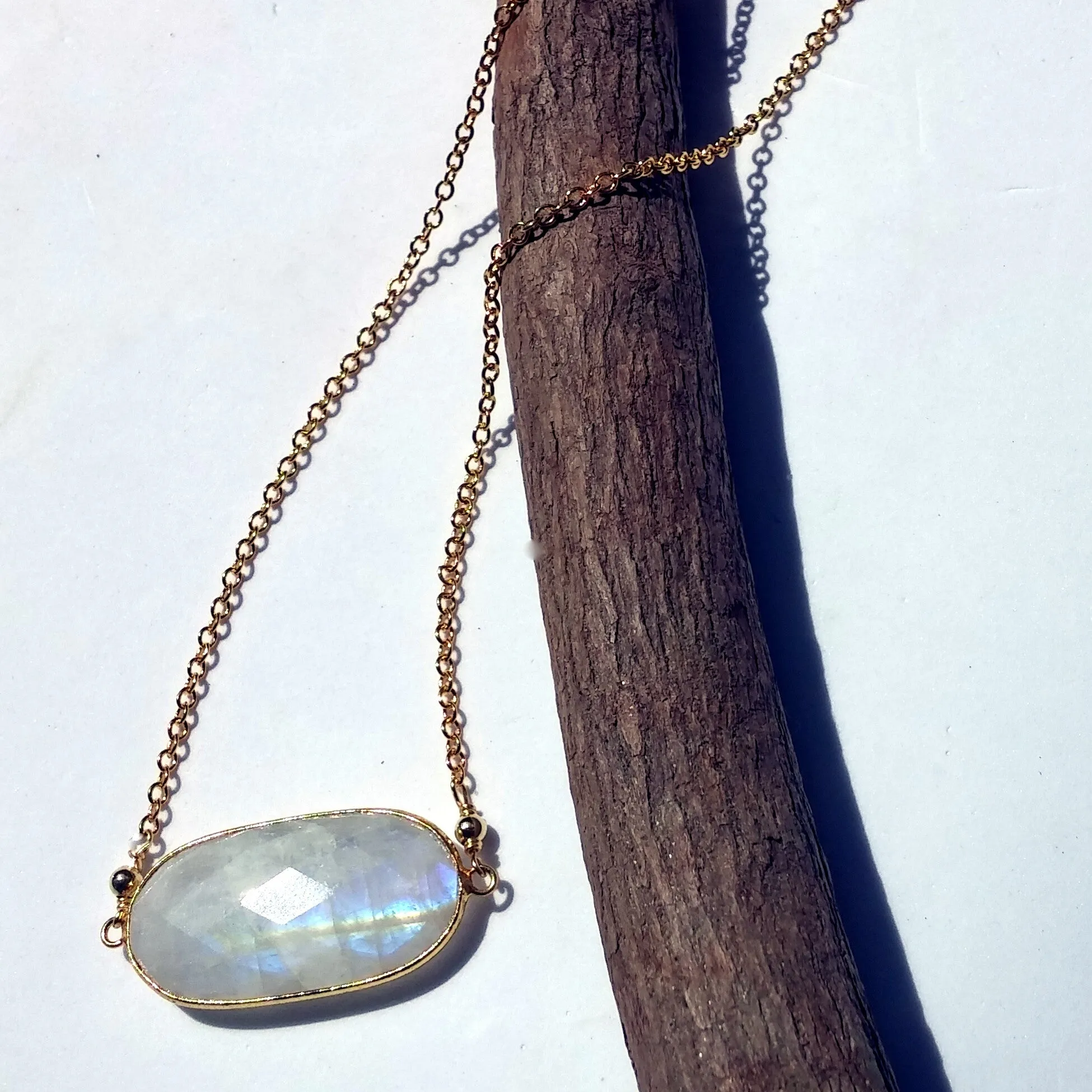 LARGE FACETED OVAL RAINBOW MOONSTONE AND GOLD NECKLACE