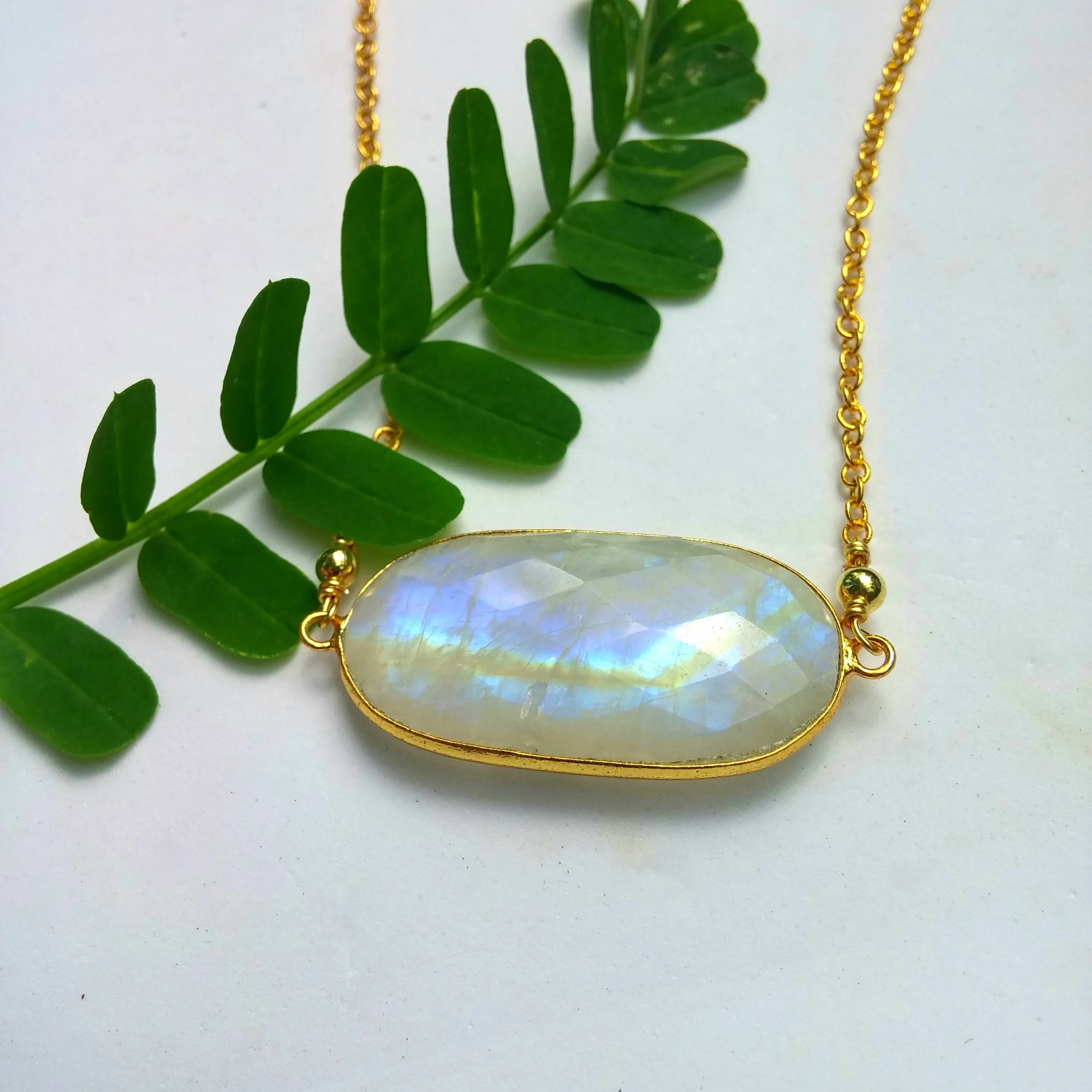 LARGE FACETED OVAL RAINBOW MOONSTONE AND GOLD NECKLACE