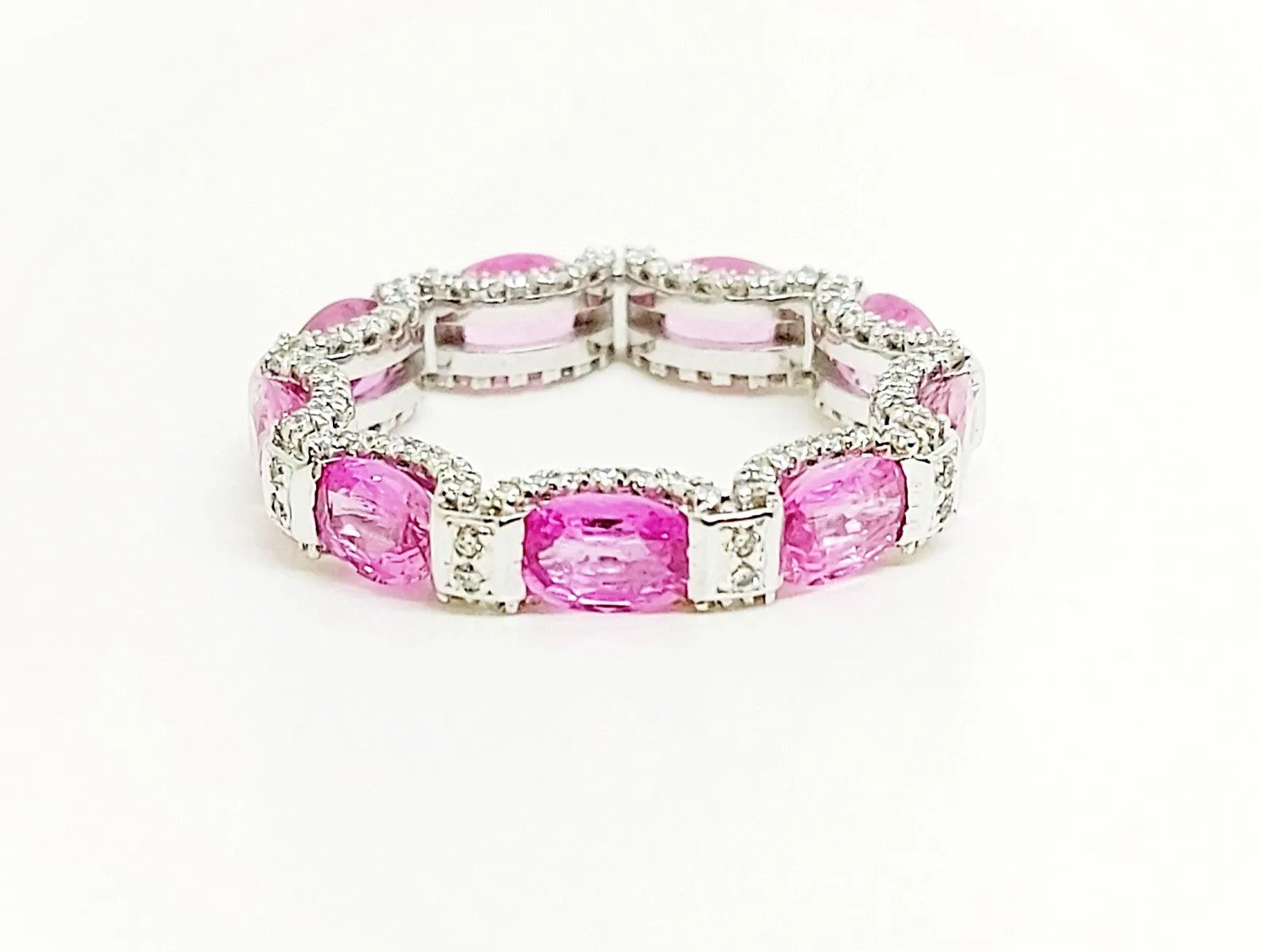 Pink sapphire and diamond hidden halo eternity band