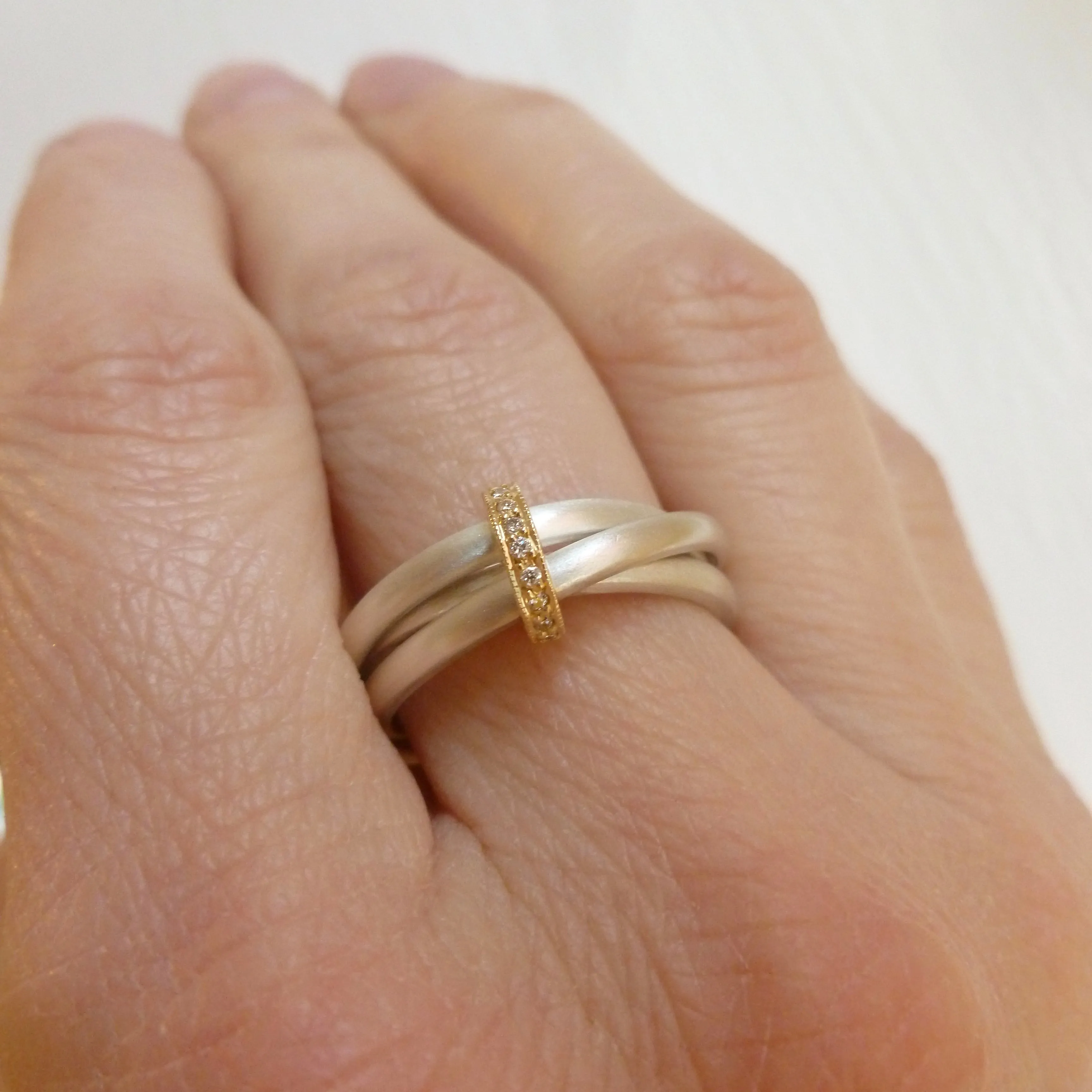Silver, 18ct gold ring with 9 diamonds